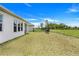 Spacious backyard with a grill and string lights, perfect for outdoor entertaining and relaxation at 18863 Rawson St, Orlando, FL 32827
