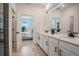 Elegant bathroom featuring a double vanity with modern fixtures, providing a spa-like experience at 18863 Rawson St, Orlando, FL 32827
