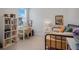 Bright bedroom with a study desk and shelves, providing a versatile space for rest and productivity at 18863 Rawson St, Orlando, FL 32827