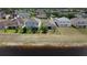 Aerial view of backyard with lake access, great neighborhood, and well-maintained fencing at 195 Preston Ave, Davenport, FL 33837