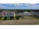 Aerial view of the home showcasing the backyard and surrounding neighborhood at 195 Preston Ave, Davenport, FL 33837