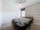 Comfortable bedroom with minimalist decor, modern bed frame, and a large closet at 195 Preston Ave, Davenport, FL 33837