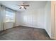 Bedroom with neutral walls, large window, and ceiling fan at 195 Preston Ave, Davenport, FL 33837