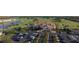 Upscale community clubhouse with a red tile roof, manicured landscaping, and ample parking at 195 Preston Ave, Davenport, FL 33837