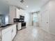 Modern kitchen showcasing stainless steel appliances, sleek cabinets, and neutral countertops at 195 Preston Ave, Davenport, FL 33837