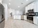 Spacious kitchen with stainless steel appliances, ample cabinet space, and an adjoining dining area at 195 Preston Ave, Davenport, FL 33837