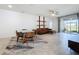 Bright living area featuring dining table, comfortable seating, modern decor, and sliding glass doors at 195 Preston Ave, Davenport, FL 33837