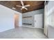 Bright living room features wood ceiling, tile flooring, geometric accent wall, and abundant natural light at 195 Preston Ave, Davenport, FL 33837