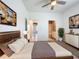 Spacious main bedroom features a ceiling fan, neutral walls, and doorway to the ensuite bathroom at 195 Preston Ave, Davenport, FL 33837