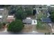 Aerial view of home with mature trees, green lawn, and paved driveway at 206 Willow St, Lake Wales, FL 33859