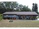Charming single-story home featuring a well-maintained lawn and mature trees at 206 Willow St, Lake Wales, FL 33859