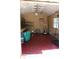 Interior view of outbuilding with shelving, air conditioner and painted floor at 206 Willow St, Lake Wales, FL 33859