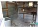 Interior view of outbuilding with utility hookups, shelving, and some moisture at 206 Willow St, Lake Wales, FL 33859