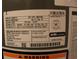 Close-up of the water heater specifications and manufacturing label at 206 Willow St, Lake Wales, FL 33859