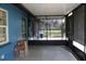 Enclosed screened porch with concrete flooring at 206 Willow St, Lake Wales, FL 33859