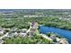 Aerial view of the community with lakefront properties and lush green landscaping at 219 Breezy Oaks Ct, Davenport, FL 33896