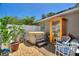 Cozy backyard featuring a hot tub, a small sauna, and outdoor seating, creating a private retreat at 219 Breezy Oaks Ct, Davenport, FL 33896
