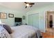 Serene bedroom with a vaulted ceiling, a TV, and closet at 219 Breezy Oaks Ct, Davenport, FL 33896