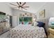 Cozy bedroom with ceiling fan, sliding door to the backyard and pool at 219 Breezy Oaks Ct, Davenport, FL 33896