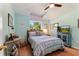 Charming bedroom with vaulted ceilings, a window view, and decor at 219 Breezy Oaks Ct, Davenport, FL 33896
