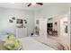 Comfortable bedroom with view into the living room and walk-in closet at 219 Breezy Oaks Ct, Davenport, FL 33896