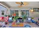 Outdoor seating on lanai with a water feature and decor, perfect for entertaining guests at 219 Breezy Oaks Ct, Davenport, FL 33896