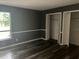 Bedroom with sleek flooring, updated paint and trim and closet at 220 E Desoto St # C, Clermont, FL 34711