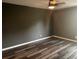 Bedroom featuring neutral paint, hard surface flooring and ceiling fan at 220 E Desoto St # C, Clermont, FL 34711