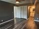 Bedroom featuring closet and ensuite bathroom with hard surface flooring at 220 E Desoto St # C, Clermont, FL 34711
