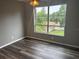 Bedroom featuring a large window and neutral paint, and ceiling fan at 220 E Desoto St # C, Clermont, FL 34711