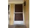 Inviting front door with screen and 'Welcome' mat at 220 E Desoto St # C, Clermont, FL 34711
