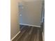 Neutral hallway with laminate floors and neutral walls at 220 E Desoto St # C, Clermont, FL 34711