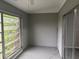 Enclosed patio with awning windows, slider and neutral paint at 220 E Desoto St # C, Clermont, FL 34711
