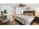 A bedroom featuring a ceiling fan, decorative pillows, a comfortable bed, and tasteful furniture at 223 Bell Tower W Xing, Poinciana, FL 34759