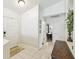 Inviting entryway showcasing tiled floors, leading to the living areas and front door at 223 Bell Tower W Xing, Poinciana, FL 34759