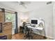 Bright home office featuring a modern desk, comfortable chair, and natural light from the window at 223 Bell Tower W Xing, Poinciana, FL 34759