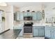 Well-equipped kitchen with stainless steel appliances, ample storage, and modern countertops at 223 Bell Tower W Xing, Poinciana, FL 34759