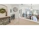 Bright, open-concept living space featuring tile floors, a dining area, and sliding doors at 223 Bell Tower W Xing, Poinciana, FL 34759