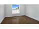 Cozy bedroom with tile floors and a view of the fenced backyard at 250 Beckenham Dr, Kissimmee, FL 34758