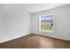 Bright bedroom with tile floors and a large window overlooking the side yard at 250 Beckenham Dr, Kissimmee, FL 34758