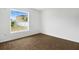 Bright bedroom with tile floors and a large window overlooking the side yard at 250 Beckenham Dr, Kissimmee, FL 34758