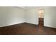 Bedroom featuring wood-style tile flooring and an ensuite bathroom at 250 Beckenham Dr, Kissimmee, FL 34758