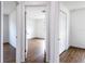 Hallway that shows a bedroom with wood-look flooring and closet at 250 Beckenham Dr, Kissimmee, FL 34758