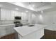 Modern kitchen featuring stainless steel appliances, quartz countertops, and a large island at 250 Beckenham Dr, Kissimmee, FL 34758