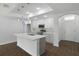 Modern kitchen featuring stainless steel appliances, quartz countertops, sleek cabinetry and large island at 250 Beckenham Dr, Kissimmee, FL 34758