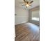 Cozy bedroom featuring laminate floors, neutral paint, and a ceiling fan at 2713 Barnsley Ln, Kissimmee, FL 34744