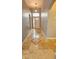Inviting foyer with light tile flooring and transom window above the front door at 2713 Barnsley Ln, Kissimmee, FL 34744