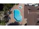 Birds eye view of the community pool and spa, highlighting the unique layout and surrounding green spaces at 2725 N Poinciana Blvd # 147, Kissimmee, FL 34746