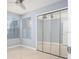 Bright bedroom with large windows, ceiling fan, and mirrored closet doors at 2725 N Poinciana Blvd # 147, Kissimmee, FL 34746