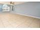 Inviting living room boasting neutral walls, tile flooring, and ample natural light at 2725 N Poinciana Blvd # 147, Kissimmee, FL 34746